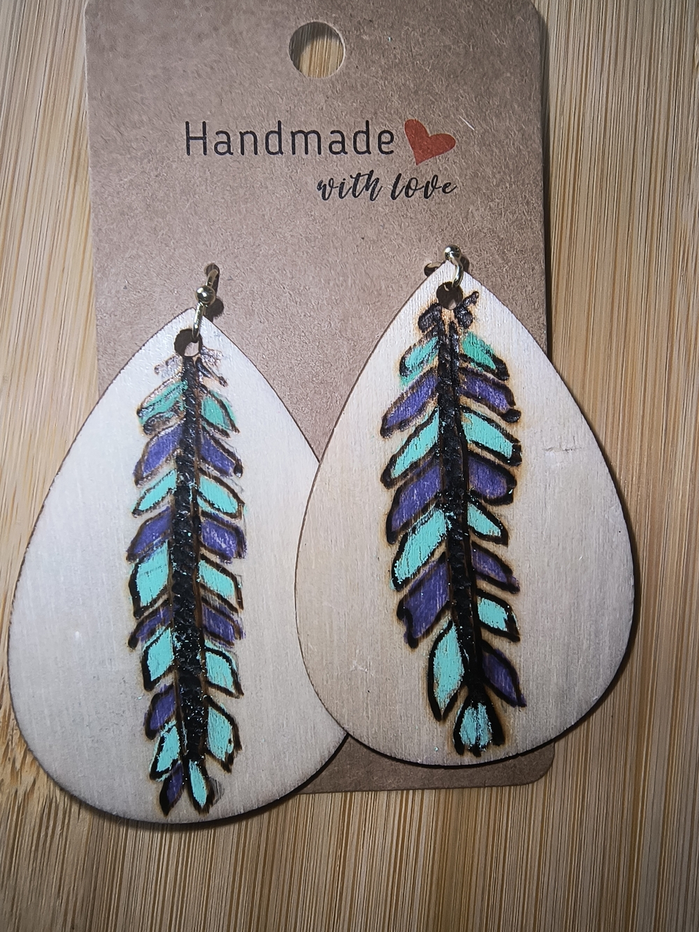 Hand Crafted Wooden Teardrop Earrings with Purple and Teal Feather Motif